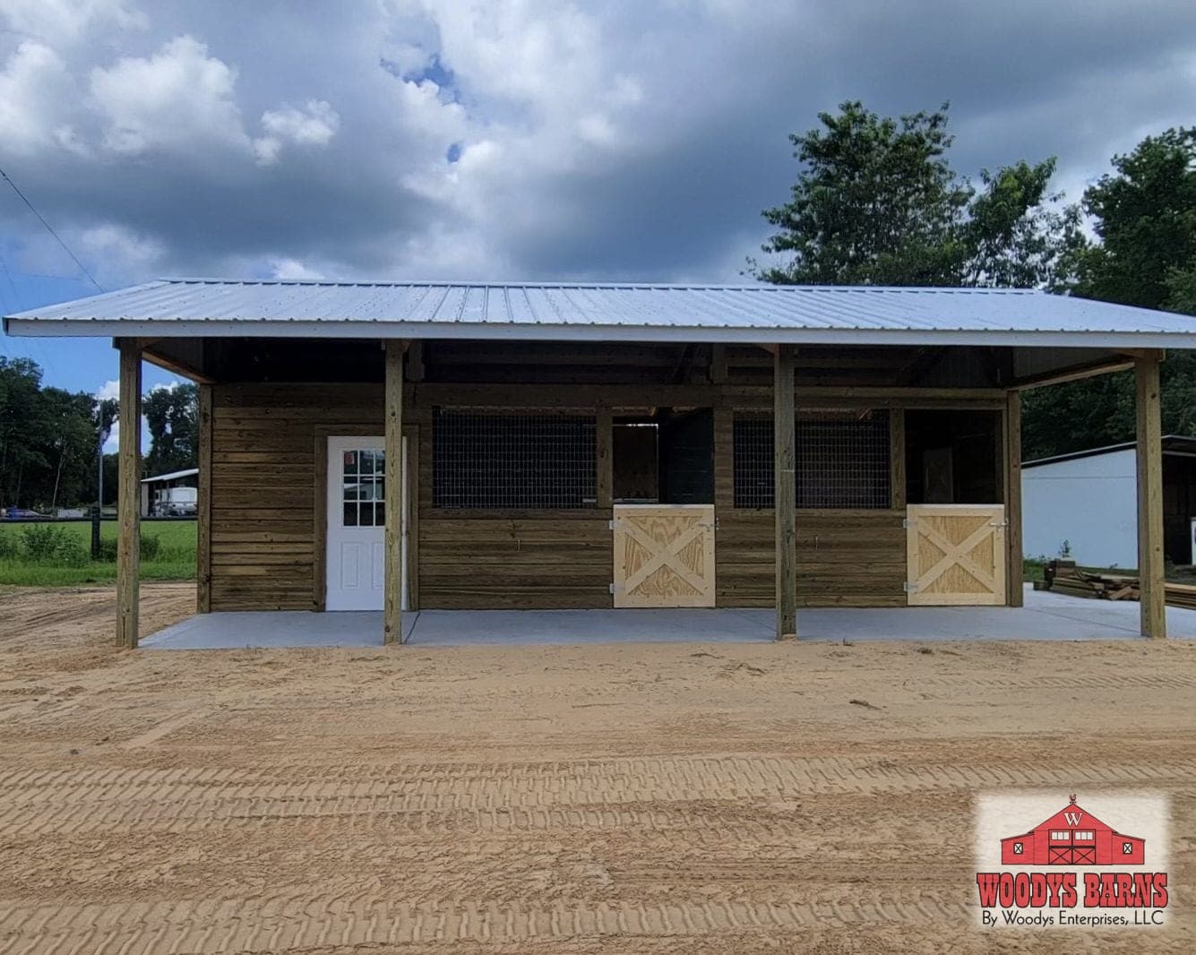 The Mikulenka shed row barn with stalls under a full length covered walkway
